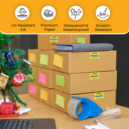 "Yellow Fragile Handle With Care stickers on stacked holiday shipping boxes showing UV-Resistant Ink, Premium Paper, Waterproof, and Scratch-Resistant features."