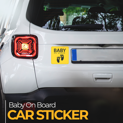 Car sticker with 'Baby on Board' text and footprints on a white car's rear window.