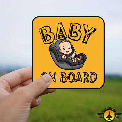 Hand holding a Baby On Board Sticker – Baby On Car Seat Design with a cartoon baby in a car seat on a yellow background.