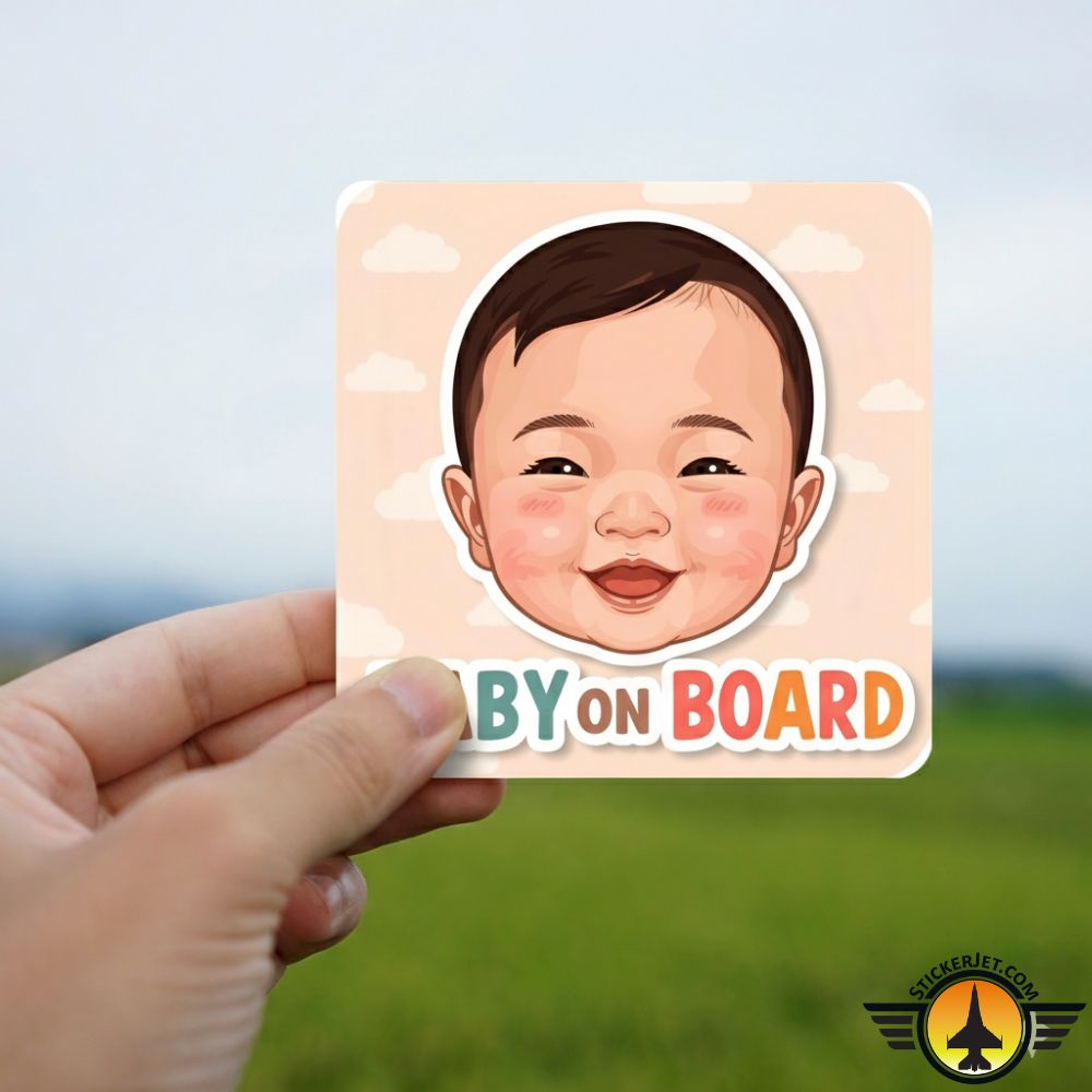 Hand holding a Baby On Board Sticker – Smiling Baby Face Design with a child's face on a blurred natural background