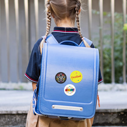 Child wearing a blue backpack with colorful Encouraging Sticker – Star Celebration Design outdoors