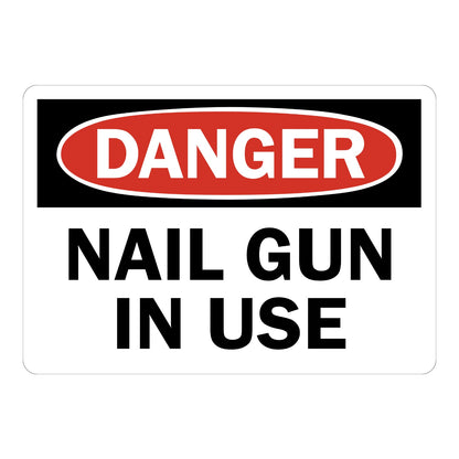 OSHA Danger Nail Gun in Use sign sticker with red oval header on a black panel and bold black text, a jobsite decal warning workers of active nail gun operation