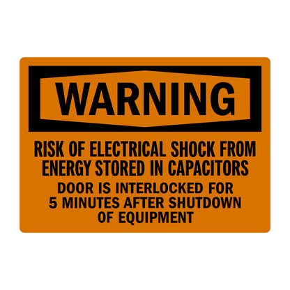OSHA Warning: Risk of Electrical Shock from Energy Stored in Capacitors sign sticker with orange background and bold black hexagon-shaped WARNING header.