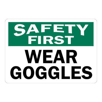 Safety First Wear Goggles OSHA sign in bold green black and white text for warehouses laboratories workshops and industrial work environments today