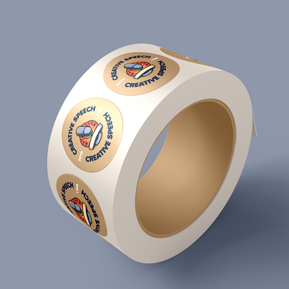 Roll of  custom circle stickers with 'Creative Speech' branding on a gray background