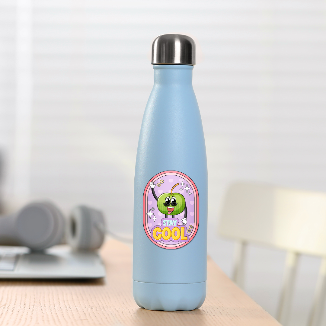 Light blue water bottle with a colorful oval stickers on a wooden desk